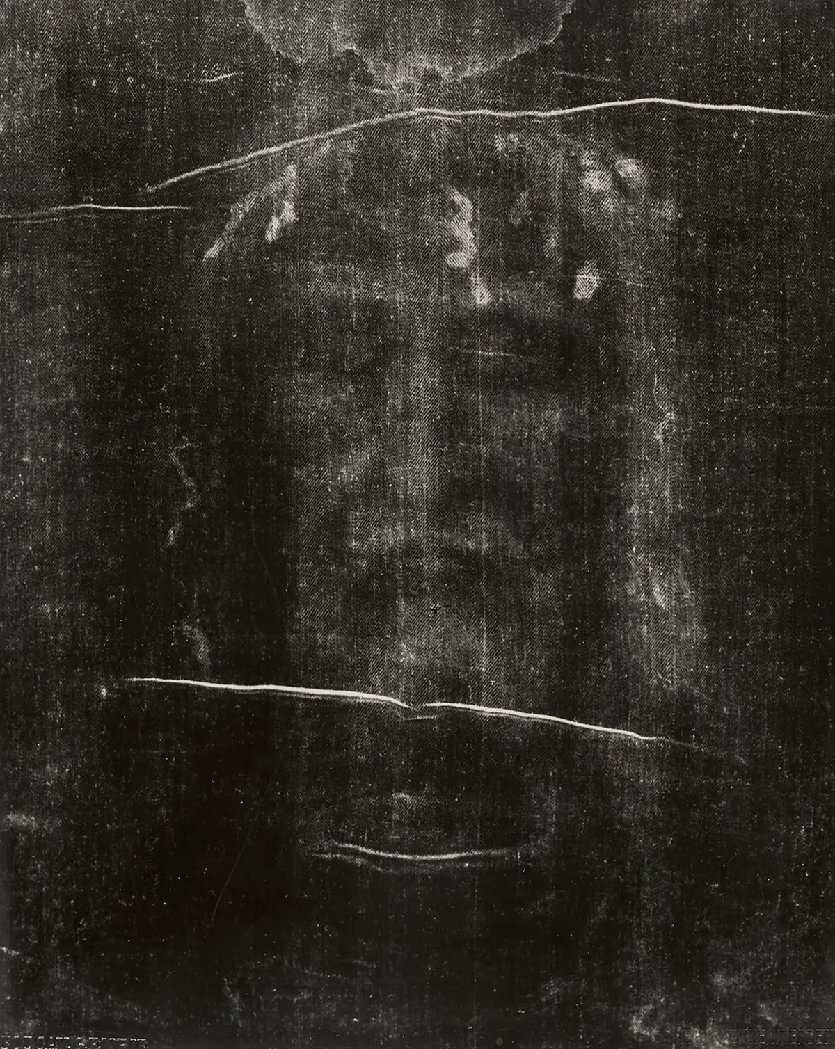 Giuseppe Enrie’s 1931 negative of the face: the image most people know, a face with shading and closed eyes.