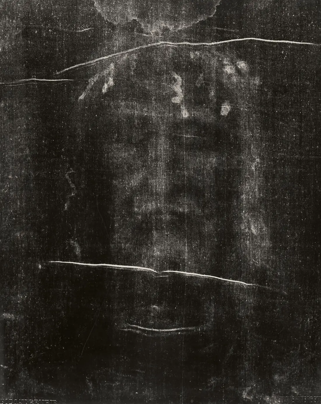 Giuseppe Enrie’s 1931 negative of the face: the image most people know, a face with shading and closed eyes.