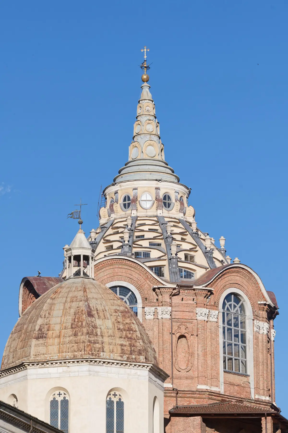 The spire and dome of the Chapel of the Holy Shroud seen from the cathedral square.
