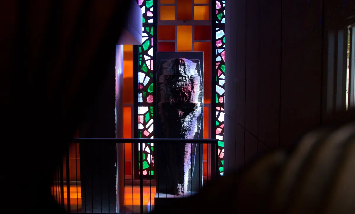 A full-length statue of a man made from the relief data of the Shroud, in a chapel.