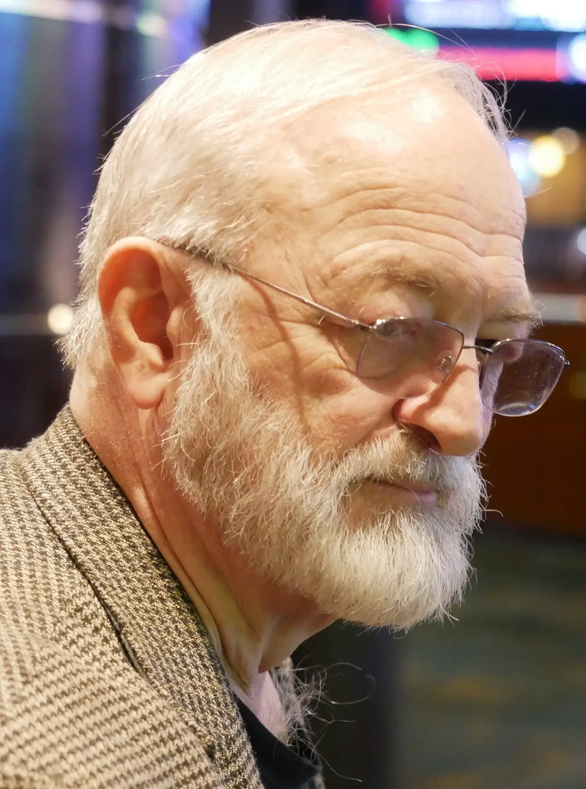 Joe Nickell, an older man with white hair and a beard, speaking.